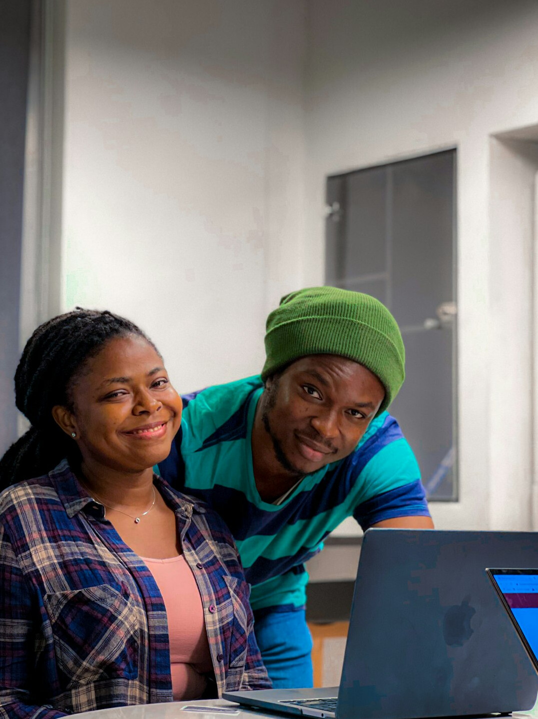 family using laptop for online courses